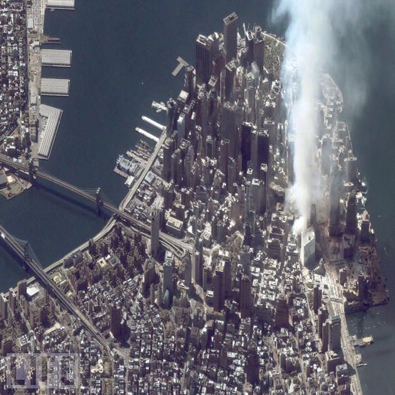 Photo:  A satellite image of lower Manhattan shows smoke and ash rising from the site of the World Trade Center at 11 43 AM on September 12, 2001